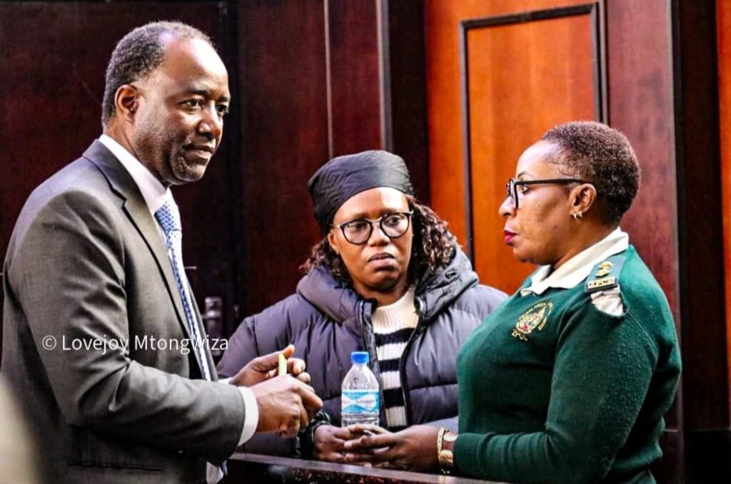ZIMBABWE: Condemning Arrest of Journalist Faith Zaba Faith Zaba at court besides the prisons officer and Chris Mike, her lawyer